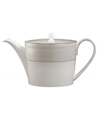 Set a dazzling tea or coffee service with this fine china teapot. From innovative designer Monique Lhullier, it features a pearlescent border with glossy raised dots and a fine stitch-like pattern. Set a dazzling tea or coffee service with this fine china teapot. From innovative designer Monique Lhullier, it features a pearlescent border with glossy raised dots and a fine stitch-like pattern.