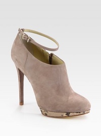 Velvety soft suede is paired with a metallic snake-print platform and topped with an adjustable ankle strap. Self-covered heel, 4½ (115mm)Metallic snake-print leather platform, ½ (15mm)Compares to a 4 heel (100mm)Suede upperAdjustable ankle strap and side zipLeather lining and solePadded insoleImported Velvety soft suede is paired with a metallic snake-print platform and topped with an adjustable ankle strap. Self-covered heel, 4½ (115mm)Metallic snake-print leather platform, ½ (15mm)Compares to a 4 heel (100mm)Suede upperAdjustable ankle strap and side zipLeather lining and solePadded insoleImported