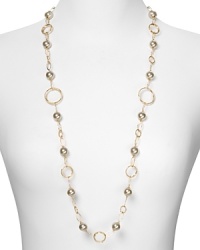 Pearls are a classic choice, yet Majorica gives them a modern spin. With contemporary gold loops and delicate stations, this piece exudes cool sophistication. Pearls are a classic choice, yet Majorica gives them a modern spin. With contemporary gold loops and delicate stations, this piece exudes cool sophistication.