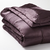 Luxurious 100% silk quilt is accented with a tufted border, reversing to cotton sateen. Solid quilted sham.