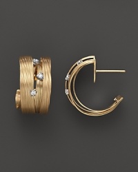 Diamonds embellish these textured gold hoop earrings from Roberto Coin. Diamonds embellish these textured gold hoop earrings from Roberto Coin.