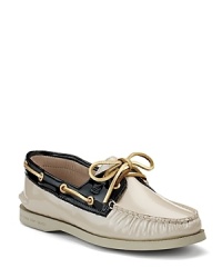 Metallic leather accents add subtle sparkle to a classic boat shoe from Sperry Top-Sider. Metallic leather accents add subtle sparkle to a classic boat shoe from Sperry Top-Sider.
