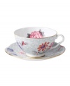 Delight in the tradition of English tea with the Cuckoo teacup and saucer set, featuring Wedgwood bone china adorned with gold bands, fanciful birds and vintage blooms. With scalloped detail.