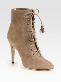 Charming tassels adorn the laces of this suede design, supported by a towering heel. Self-covered heel, 4 (100mm)Suede upperBack zipLeather lining and solePadded insoleMade in Italy Charming tassels adorn the laces of this suede design, supported by a towering heel. Self-covered heel, 4 (100mm)Suede upperBack zipLeather lining and solePadded insoleMade in Italy