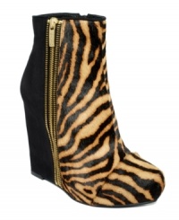 Two-for-one glam. Zebra-print cow hair and black suede are joined together by one awesome exposed zipper on the upper of RACHEL Rachel Roy's Camino wedge booties. Two-for-one glam. Zebra-print cow hair and black suede are joined together by one awesome exposed zipper on the upper of RACHEL Rachel Roy's Camino wedge booties.