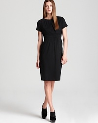 This stretch silk Burberry London LBD approaches your schedule with effortless elegance, polished for the workday and posh for after hours. This stretch silk Burberry London LBD approaches your schedule with effortless elegance, polished for the workday and posh for after hours.