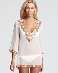 Sheerly stylish, this Milly swim coverup features embroidered sequin trim that makes the look sparkle for day and into the evening-cocktails, anyone? Sheerly stylish, this Milly swim coverup features embroidered sequin trim that makes the look sparkle for day and into the evening-cocktails, anyone?