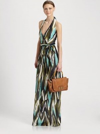 Muted ikat-print on woven cotton and silk, styled with a flattering halter bodice and floor-sweeping hem.Halter strap ties at neckSurplice bodiceSelf-beltTiered hemAbout 37 from natural waist53% silk/47% cottonDry cleanMade in USA of imported fabricModel shown is 5'9½ (176cm) wearing US size 4. Muted ikat-print on woven cotton and silk, styled with a flattering halter bodice and floor-sweeping hem.Halter strap ties at neckSurplice bodiceSelf-beltTiered hemAbout 37 from natural waist53% silk/47% cottonDry cleanMade in USA of imported fabricModel shown is 5'9½ (176cm) wearing US size 4.