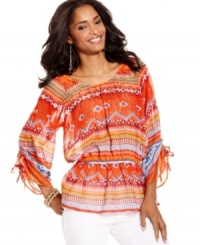 A flattering blouson-style fit, dramatic drawstring-ruched cuffs and a statement-making print make this Style&co. top a head-turner. The colors pop when you wear with white bottoms, or try denim to downplay it a touch. A flattering blouson-style fit, dramatic drawstring-ruched cuffs and a statement-making print make this Style&co. top a head-turner. The colors pop when you wear with white bottoms, or try denim to downplay it a touch.