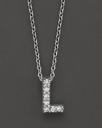 From the Tiny Treasures collection, a diamond L necklace. With signature ruby accent. Designed by Roberto Coin. From the Tiny Treasures collection, a diamond L necklace. With signature ruby accent. Designed by Roberto Coin.