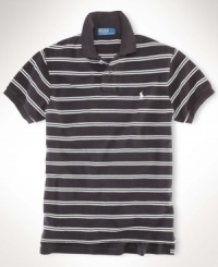 A classic-fitting short-sleeved polo shirt is crafted from breathable cotton mesh with a sleek striped pattern for casual polish. A classic-fitting short-sleeved polo shirt is crafted from breathable cotton mesh with a sleek striped pattern for casual polish.