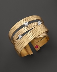 Diamonds embellish this textured 18K yellow gold ring from Roberto Coin. Diamonds embellish this textured 18K yellow gold ring from Roberto Coin.