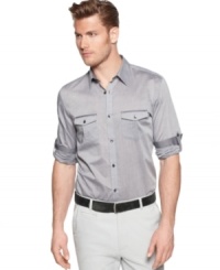 Increase your visibility at the office or on the town with this chambray shirt from Calvin Klein. Increase your visibility at the office or on the town with this chambray shirt from Calvin Klein.