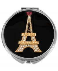 The French connection. This black compact from Betsey Johnson is stylized with an Eiffel Tower, crafted from gold-tone mixed metal and featuring glass crystal accents, on top for a touch of Parisian flair. Item comes packaged in a signature Betsey Johnson Gift Box. Approximate length: 3 inches. Approximate width: 3 inches. The French connection. This black compact from Betsey Johnson is stylized with an Eiffel Tower, crafted from gold-tone mixed metal and featuring glass crystal accents, on top for a touch of Parisian flair. Item comes packaged in a signature Betsey Johnson Gift Box. Approximate length: 3 inches. Approximate width: 3 inches.