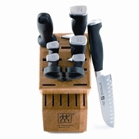 Set includes: 2 3/4 Peeler, 4 Parer/Utility Knife, 5 Serrated/Utility Knife, 5 Santoku Hollow Edge, 8 Chef's Knife, 8 Bread Knife, 9 Steel, Kitchen Shear and Hardwood Block with steak slots. If purchased separately, $667.00. Set includes: 2 3/4 Peeler, 4 Parer/Utility Knife, 5 Serrated/Utility Knife, 5 Santoku Hollow Edge, 8 Chef's Knife, 8 Bread Knife, 9 Steel, Kitchen Shear and Hardwood Block with steak slots. If purchased separately, $667.00.
