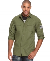This Rocawear button down has a military-style design and sleek modern fit. This Rocawear button down has a military-style design and sleek modern fit.