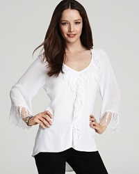 A glorious return to effortless romance, this XCVI top seduces us all with cascading ruffles and intricate crochet. A glorious return to effortless romance, this XCVI top seduces us all with cascading ruffles and intricate crochet.