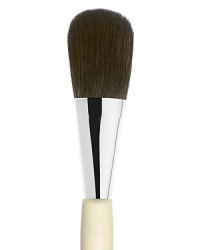 An oversized brush to apply face powder made of luxuriously soft black squirrel hair. An oversized brush to apply face powder made of luxuriously soft black squirrel hair.