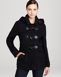 Battle the elements with this classic toggle-accented duffel coat from Barbour--a must-have for your winter wardrobe. Battle the elements with this classic toggle-accented duffel coat from Barbour--a must-have for your winter wardrobe.