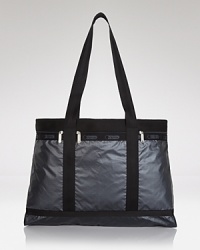 Crafted of nylon and sized for carry-on capacity, this LeSportsac travel tote is the for-always, go-everywhere, essential. Crafted of nylon and sized for carry-on capacity, this LeSportsac travel tote is the for-always, go-everywhere, essential.