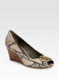 A gleaming logo medallion tops this rippled snake-print leather pump, heightened by a stacked wedge. Stacked wedge, 2½ (65mm)Python-print leather upperPeep toeLeather liningRubber solePadded insoleImported