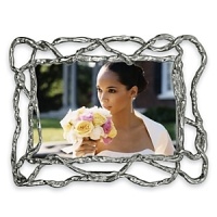 Designed by renowned artist Michael Aram, the beautiful Wisteria frame features organic lines that recall intertwined vines. Tarnish resistant and utterly chic, it adds immediate style to any room. Designed by renowned artist Michael Aram, the beautiful Wisteria frame features organic lines that recall intertwined vines. Tarnish resistant and utterly chic, it adds immediate style to any room.