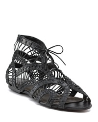 The airy, lacy look of these flat sandals is anchored by tough black leather. By Joie. The airy, lacy look of these flat sandals is anchored by tough black leather. By Joie.
