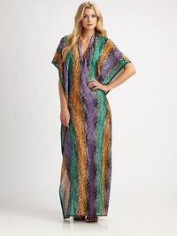 An elongating coverup with a vibrant print, seductive neckline and feminine fit.Deep v-neckKimono sleevesPull-on styleRayon/polyester/cottonDry cleanMade in Italy of imported fabric An elongating coverup with a vibrant print, seductive neckline and feminine fit.Deep v-neckKimono sleevesPull-on styleRayon/polyester/cottonDry cleanMade in Italy of imported fabric