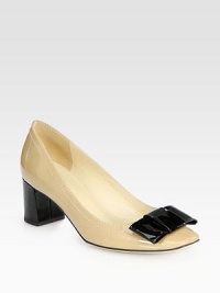 An irresistible large bow is the perfect finishing touch on this two-tone patent leather silhouette. Stacked heel, 2¼ (60mm)Patent leather upperLeather lining and solePadded insoleImported An irresistible large bow is the perfect finishing touch on this two-tone patent leather silhouette. Stacked heel, 2¼ (60mm)Patent leather upperLeather lining and solePadded insoleImported