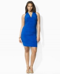 Rendered in luxurious matte jersey, a plus size cocktail dress is designed with elegant ruching along the bodice for a glamorous draping effect, from Lauren by Ralph Lauren. Rendered in luxurious matte jersey, a plus size cocktail dress is designed with elegant ruching along the bodice for a glamorous draping effect, from Lauren by Ralph Lauren.