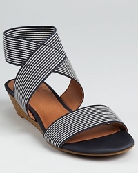 Nautical style gets a subtle lift on these Lucky Brand sandals, boasting a demi-wedge and skinny stripes. Nautical style gets a subtle lift on these Lucky Brand sandals, boasting a demi-wedge and skinny stripes.