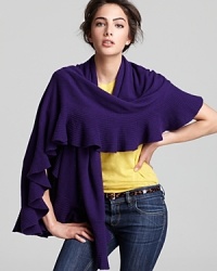 Rolling ruffles lend feminine inspiration to a cashmere Magaschoni scarf. Rolling ruffles lend feminine inspiration to a cashmere Magaschoni scarf.