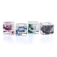 Designed by Kosta Boda's Anna Ehrner, the Brick series chicly creates artful ambiance. Floating splashes of black, white, blue, green and purple make each transparent votive unique. Designed by Kosta Boda's Anna Ehrner, the Brick series chicly creates artful ambiance. Floating splashes of black, white, blue, green and purple make each transparent votive unique.