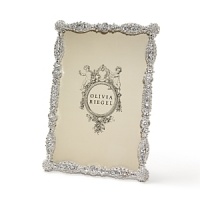 Imperial look in this meticulously detailed frame with dozens of hand-set Swarovski crystals and beading work. Imperial look in this meticulously detailed frame with dozens of hand-set Swarovski crystals and beading work.