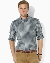 A versatile essential for every gentleman's wardrobe, a soft oxford-woven cotton sport shirt is tailored in a classic-fitting silhouette for timeless style. A versatile essential for every gentleman's wardrobe, a soft oxford-woven cotton sport shirt is tailored in a classic-fitting silhouette for timeless style.
