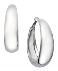 Ladies, let's talk hoops! Big or small, silver or gold, every girl needs 'em in her collection! INC International Concepts' statement-making style features a wide hoop design set in silver tone mixed metal. Approximate diameter: 2 inches. Ladies, let's talk hoops! Big or small, silver or gold, every girl needs 'em in her collection! INC International Concepts' statement-making style features a wide hoop design set in silver tone mixed metal. Approximate diameter: 2 inches.