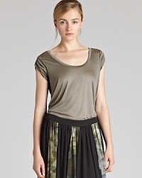 A REISS tee earns its place in your wardrobe, cut with chic, twisted short sleeves. Wear it with jeans (of course), tucked into tailored trousers, or even loose over a pleated skirt. A REISS tee earns its place in your wardrobe, cut with chic, twisted short sleeves. Wear it with jeans (of course), tucked into tailored trousers, or even loose over a pleated skirt.