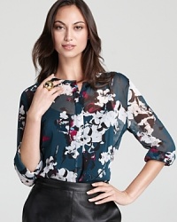 Painterly blossoms bloom from a sheer DKNY blouse for an effortlessly romantic sentiment. Slip the feminine style into a tough-girl pencil skirt for 9-to-5 glam. Painterly blossoms bloom from a sheer DKNY blouse for an effortlessly romantic sentiment. Slip the feminine style into a tough-girl pencil skirt for 9-to-5 glam.