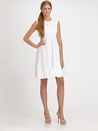 A cluster of circle buttons accent the neckline of this top-fit linen frock styled with a revealing open back.Jewel necklineSleevelessBodice dartsSet-in waistPleated skirtBack button tab closureLower center back zipperAbout 23 from natural waist56% tencel/44% linenDry cleanMade in USA of imported fabricModel shown is 5'11 (180cm) wearing US size 4. A cluster of circle buttons accent the neckline of this top-fit linen frock styled with a revealing open back.Jewel necklineSleevelessBodice dartsSet-in waistPleated skirtBack button tab closureLower center back zipperAbout 23 from natural waist56% tencel/44% linenDry cleanMade in USA of imported fabricModel shown is 5'11 (180cm) wearing US size 4.