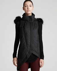 This direction Helmut Lang vest flaunts fluffy fur trim for a posh look that contrasts against the edgy silhouette for modern luxe. This direction Helmut Lang vest flaunts fluffy fur trim for a posh look that contrasts against the edgy silhouette for modern luxe.