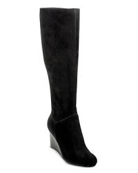 Tall suede boots set on wedges are a sophisticated way to add understated, easygoing style to your everyday wardrobe; by Cole Haan. Tall suede boots set on wedges are a sophisticated way to add understated, easygoing style to your everyday wardrobe; by Cole Haan.