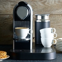 Combining two of their most popular products, the architecture-inspired CitiZ Espresso Maker with the Aeroccino Plus frother, this all-in-one machine is sure to appeal to design enthusiasts and coffee connoisseurs alike. Premium ground coffee capsules and a button-activated milk frother, make it a cinch to brew the perfect cup every time. Combining two of their most popular products, the architecture-inspired CitiZ Espresso Maker with the Aeroccino Plus frother, this all-in-one machine is sure to appeal to design enthusiasts and coffee connoisseurs alike. Premium ground coffee capsules and a button-activated milk frother, make it a cinch to brew the perfect cup every time.