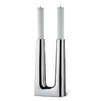 The candlestick was originally created in 1960 as an altar candle for use in a modern Scandinavian-style church.The 2007 version is in stainless steel and holds two tapered candles-the effect is striking. The structure of the candleholder is in many ways an iconic example of clean-lined Danish design of the post-World War II era. The candlestick was originally created in 1960 as an altar candle for use in a modern Scandinavian-style church.The 2007 version is in stainless steel and holds two tapered candles-the effect is striking. The structure of the candleholder is in many ways an iconic example of clean-lined Danish design of the post-World War II era.