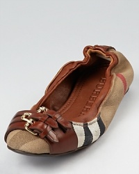 Burberry packs major style into slight ballerina flats, with a triple buckle detail and rich claret leather accents on a signature plaid backdrop. Burberry packs major style into slight ballerina flats, with a triple buckle detail and rich claret leather accents on a signature plaid backdrop.