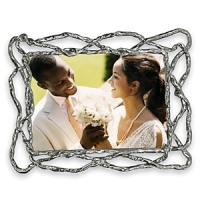 Designed by renowned artist Michael Aram, the beautiful Wisteria frame features organic lines that recall intertwined vines. Tarnish resistant and utterly chic, it adds immediate style to any room. Designed by renowned artist Michael Aram, the beautiful Wisteria frame features organic lines that recall intertwined vines. Tarnish resistant and utterly chic, it adds immediate style to any room.