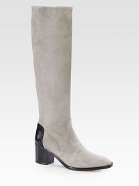 Exude casual elegance with this buttery suede silhouette, backed by a contrasting pebbled leather detail. Stacked heel, 2½ (65mm)Shaft, 16Leg circumference, 14Suede and leather upperPull-on styleLeather lining and solePadded insoleMade in Italy Exude casual elegance with this buttery suede silhouette, backed by a contrasting pebbled leather detail. Stacked heel, 2½ (65mm)Shaft, 16Leg circumference, 14Suede and leather upperPull-on styleLeather lining and solePadded insoleMade in Italy