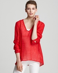Rendered in a light-as-air knit, this Eileen Fisher tunic is designed with a stylish dipped hem for full coverage over your favorite leggings. Rendered in a light-as-air knit, this Eileen Fisher tunic is designed with a stylish dipped hem for full coverage over your favorite leggings.