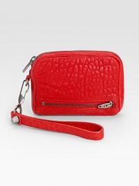 Rich and supple pebbled lambskin leather in a portable size.Detachable wrist strap, 6½ dropTop zip closureTwo outside zip pocketsFour credit card slotsTwo inside open pocketsFully lined5¾W X 4½H X 1DImported Rich and supple pebbled lambskin leather in a portable size.Detachable wrist strap, 6½ dropTop zip closureTwo outside zip pocketsFour credit card slotsTwo inside open pocketsFully lined5¾W X 4½H X 1DImported
