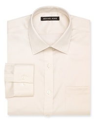 A regular fit Michael Kors non-iron dress shirt featuring a spread collar, barrel cuffs and a left chest pocket. A regular fit Michael Kors non-iron dress shirt featuring a spread collar, barrel cuffs and a left chest pocket.