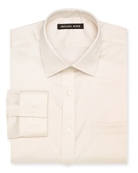 A regular fit Michael Kors non-iron dress shirt featuring a spread collar, barrel cuffs and a left chest pocket.